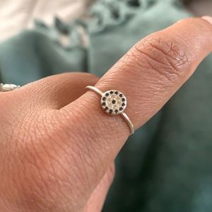 Ring with black and white stones